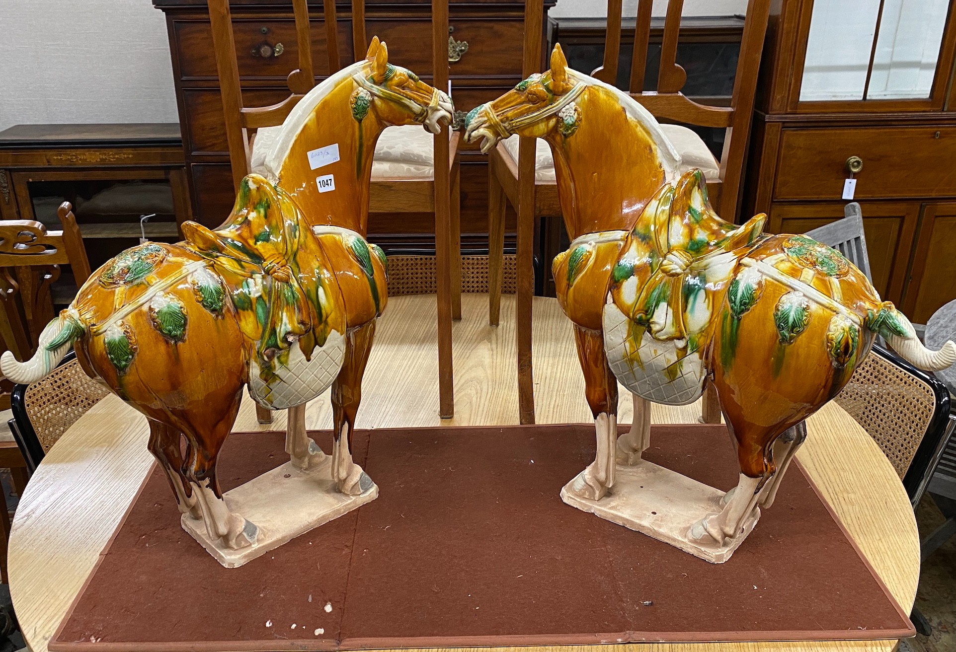 Two Tang style glazed pottery tomb horses, height 70cm